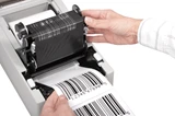 desktop-printer-hands-opened-barcode-printed